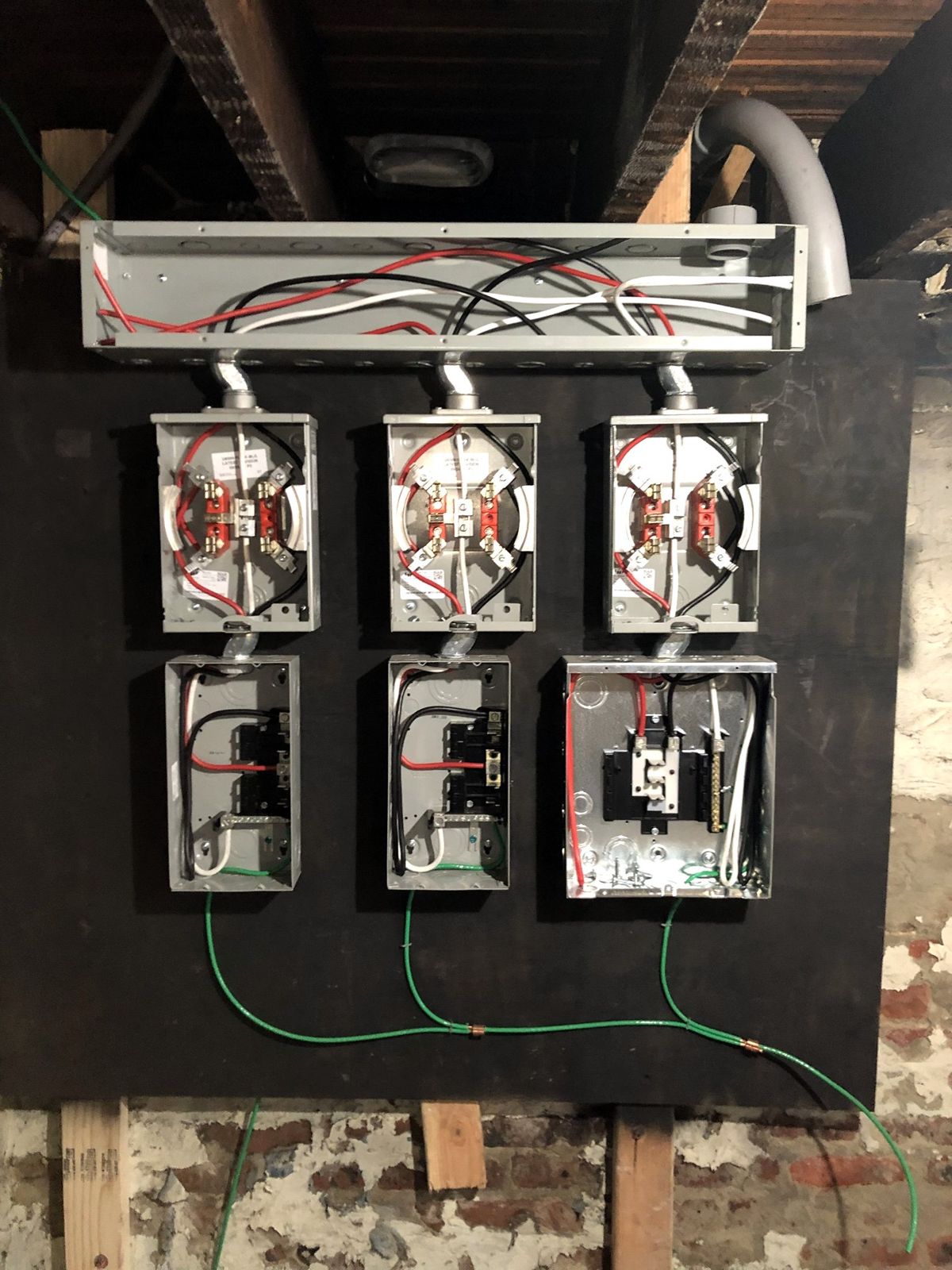New three-meter electrical service with gutter, meter sockets and disconnects, grounding bonded